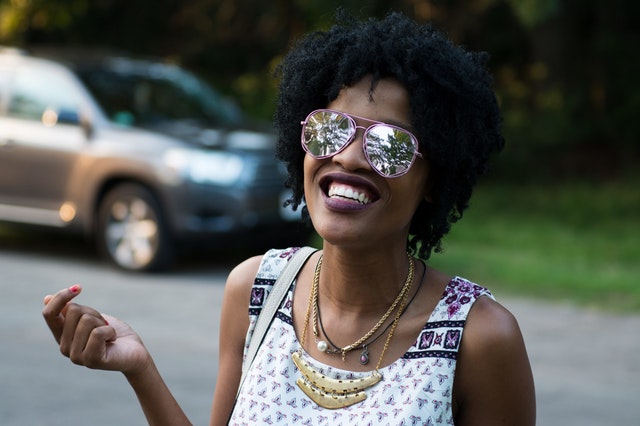 Happy woman with confident smile after Invisalign treatment